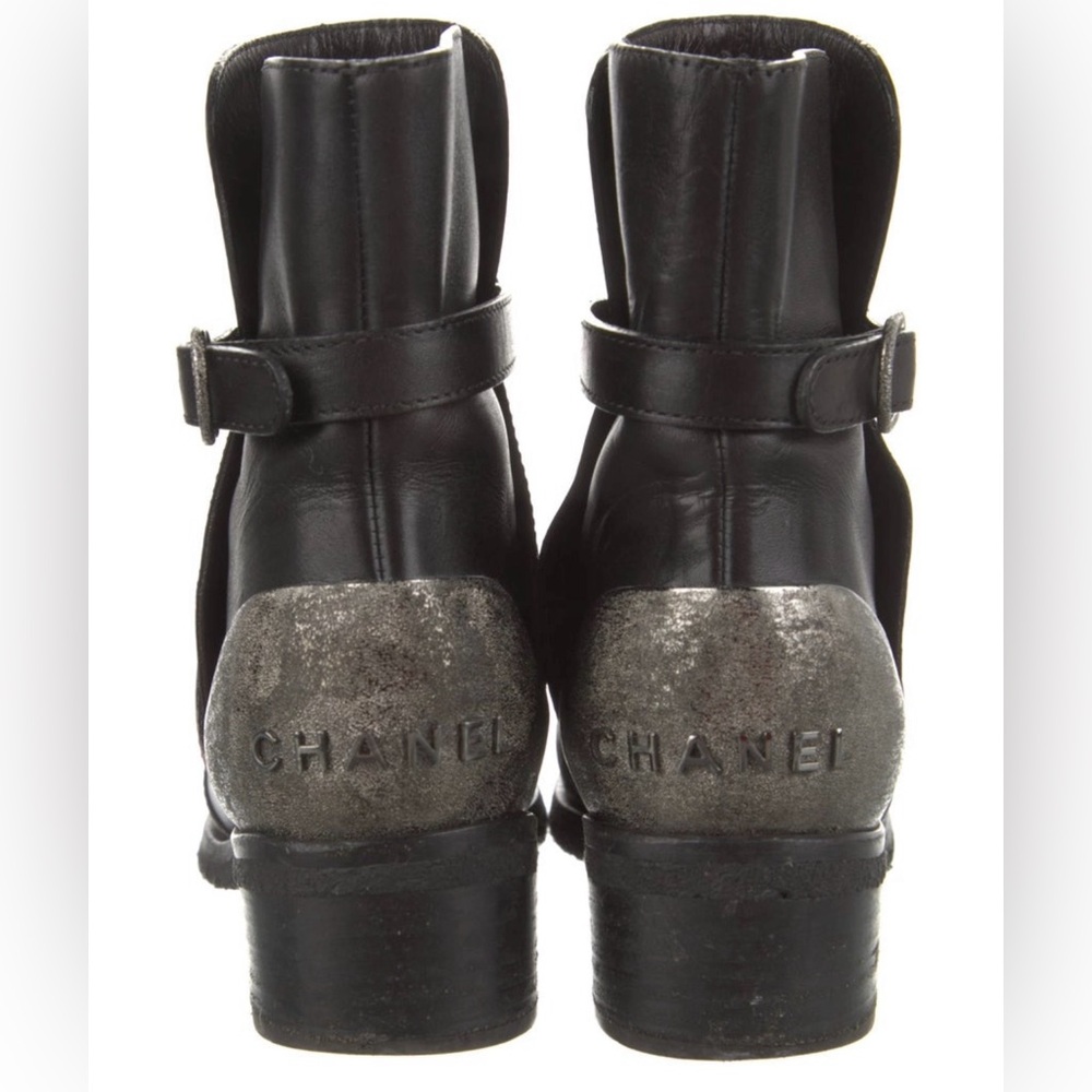 Chanel black leather moto boots with silver Chanel sign